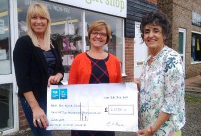 Carole presenting money to Julie Russell