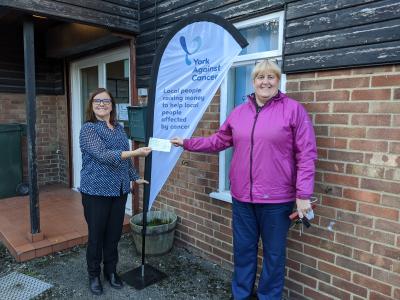Julie Russell, left receives the Dunnington donation from Anne Abbiss
