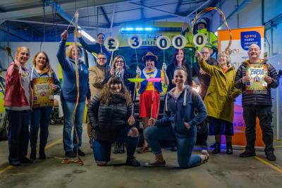 The Blue Light Theatre Company present their fundraising cash to the charities they support.jpg