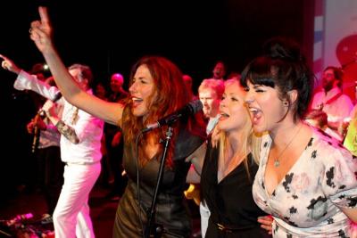 people on stage at york rocks against cancer