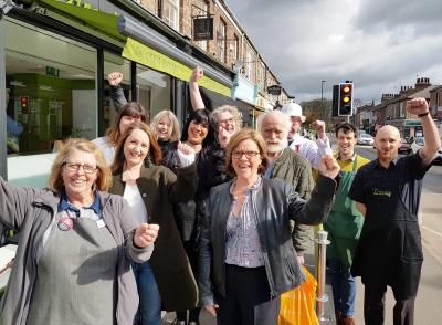 Traders and customers in Bishopthorpe Road with, centre front, Julie Russell of York Against Cancer