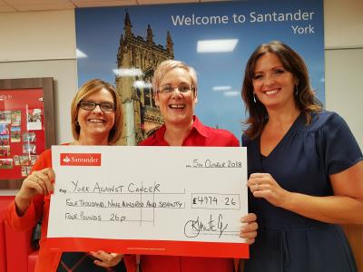 Our General Manager Julie Russell receives the walkers' cheque