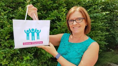 Julie Russell with Cancer Champion literature