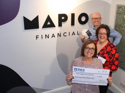 Scott Anscomb and Liz Murdie present Julie Russell with a £500 cheque