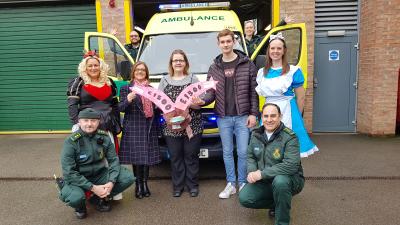 Panto members hand over the cash raised at their 2019 show