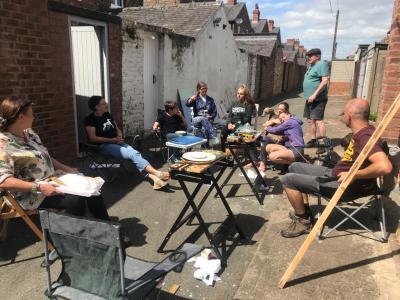 SmART team mbers discuss their art show plans
