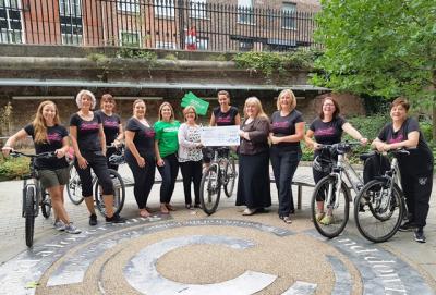 Members of the Heels on Wheels team with cancer charity representatives