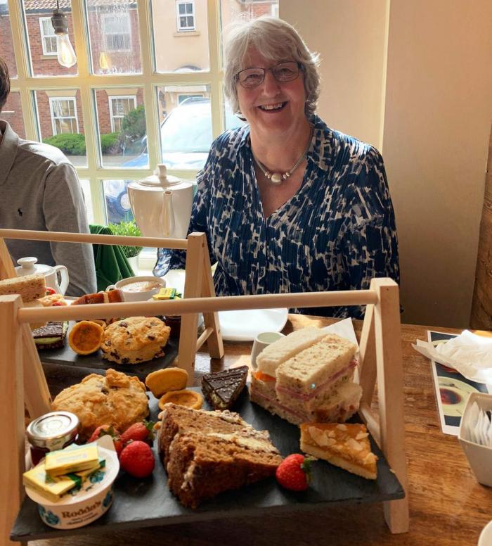 Joan enjoys afternoon tea during her time at Filey