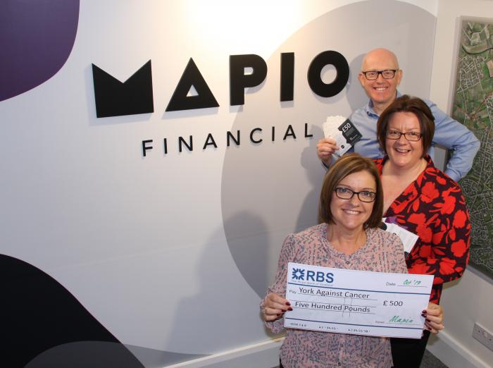 Scott Anscomb and Liz Murdie present Julie Russell with a £500 cheque Scott Anscomb and Liz Murdie present Julie Russell with a £500 cheque