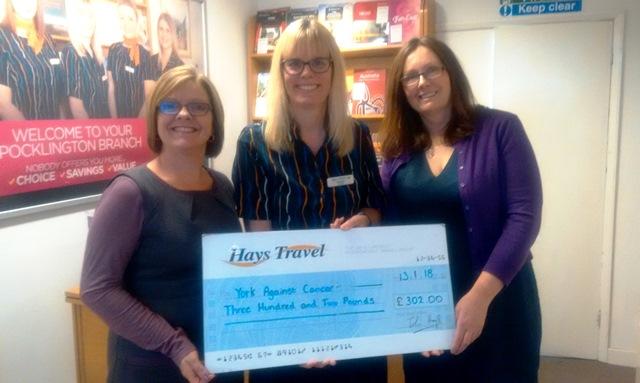 Julie Russell and Fran Clee from our charity receive a cheque from Hays Travel's Michelle Creaser