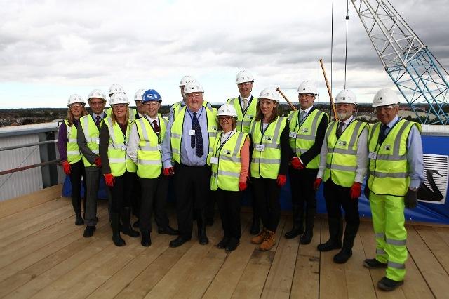ulie Russell (centre) and fellow stadium partners at the topping-out ceremony Julie Russell (centre) and fellow stadium partners at the topping-out ceremony